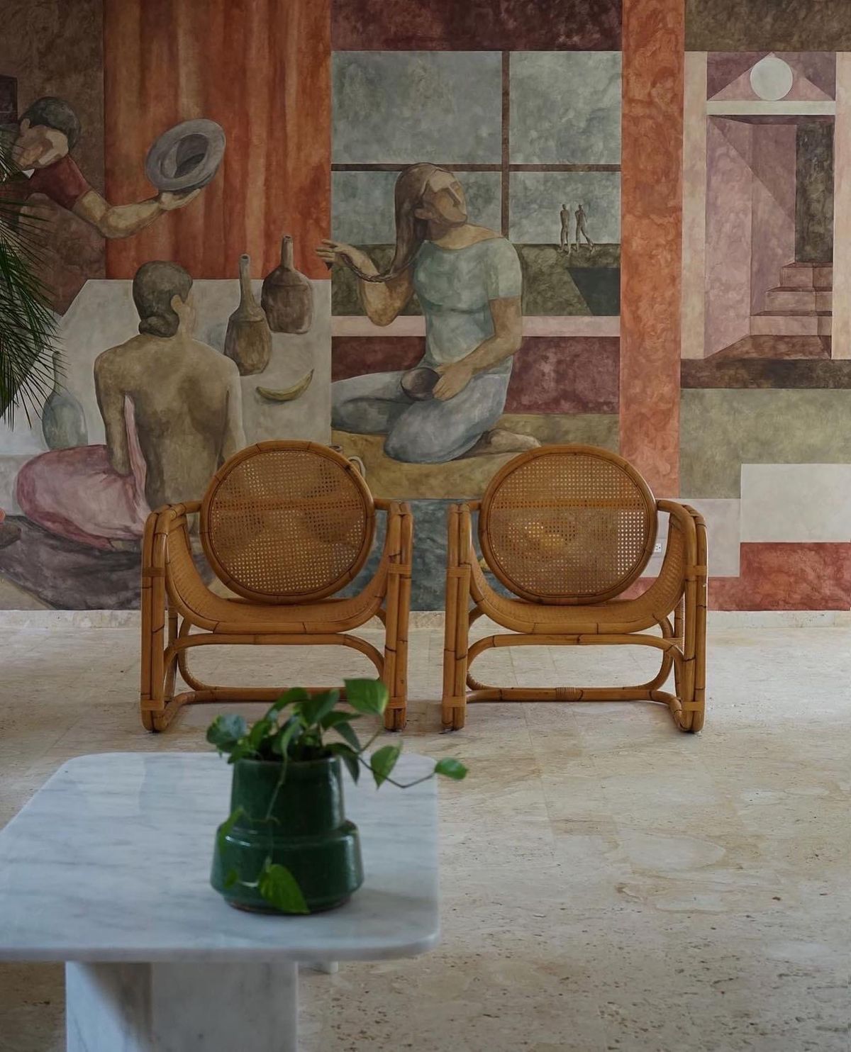 Mediterranean mural with rattan chairs