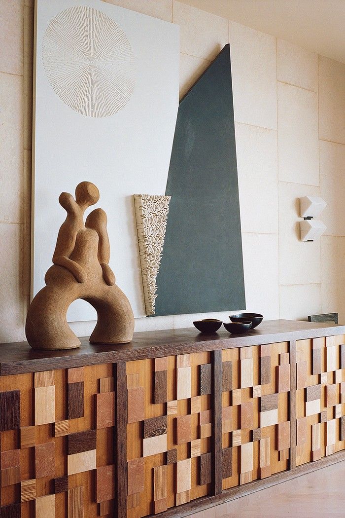 Sand sculpture on patchwork credenza