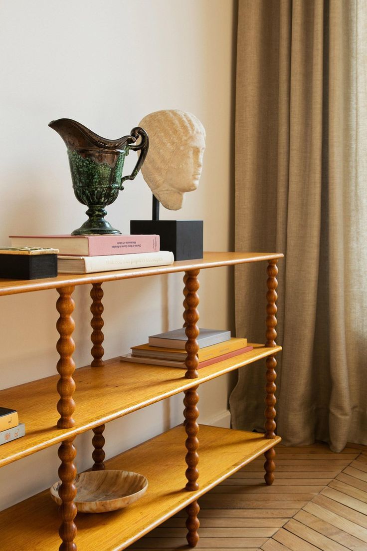 Classical bust on bobbin shelf