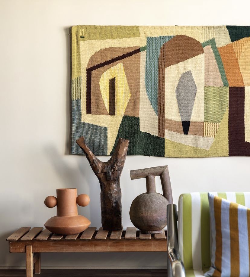 Woven tapestry with ceramic sculptures