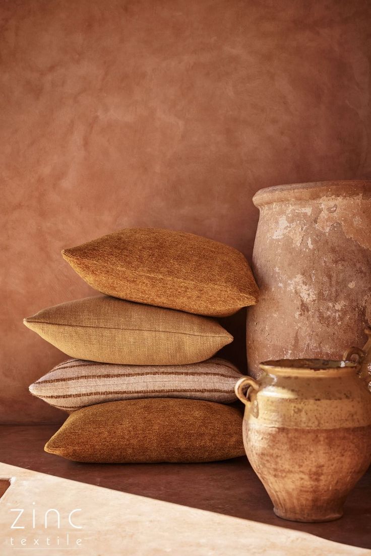 Zinc textiles — ochre and sienna cushions